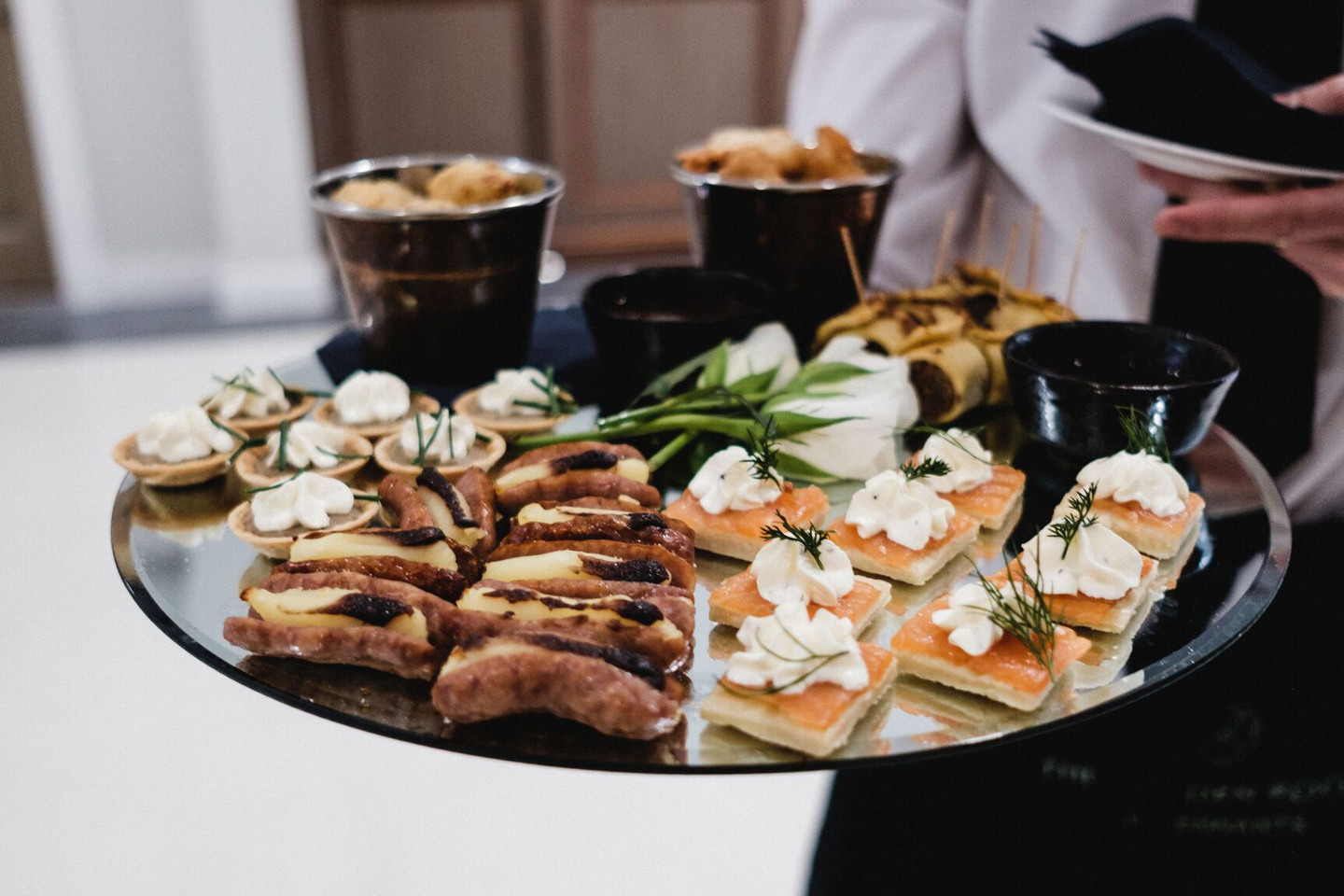 Canapes on a silver mirrored plate