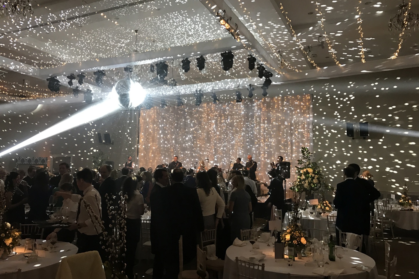 Garden Rooms set up for wedding reception, with round tables