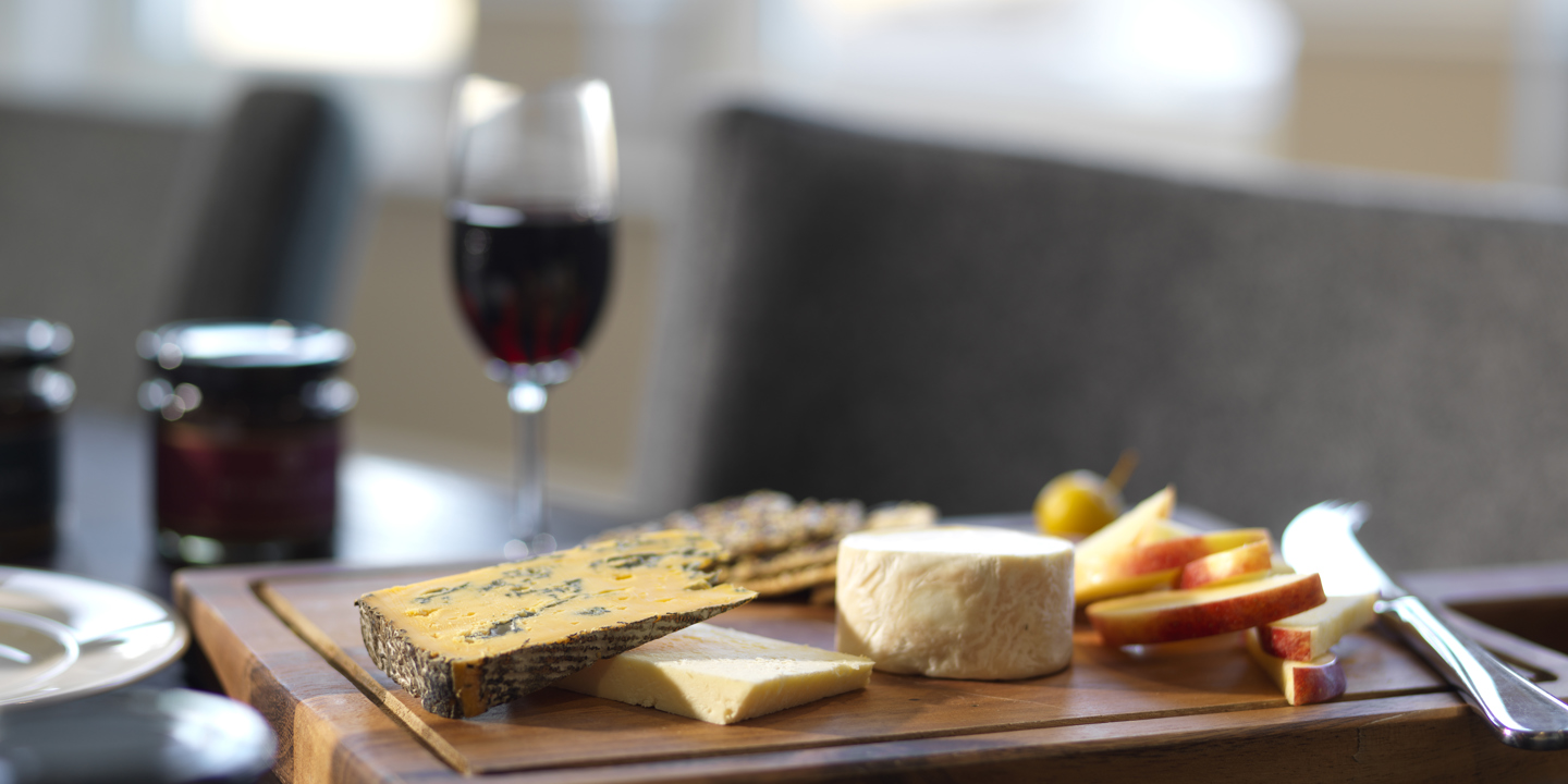 Cheese board and a glass of red wine
