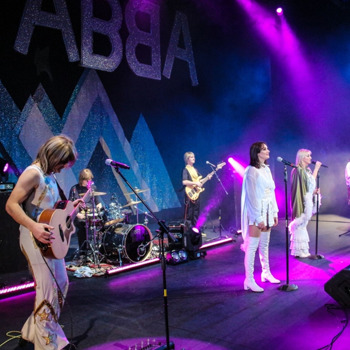 ABBA tribute concert performing on stage 