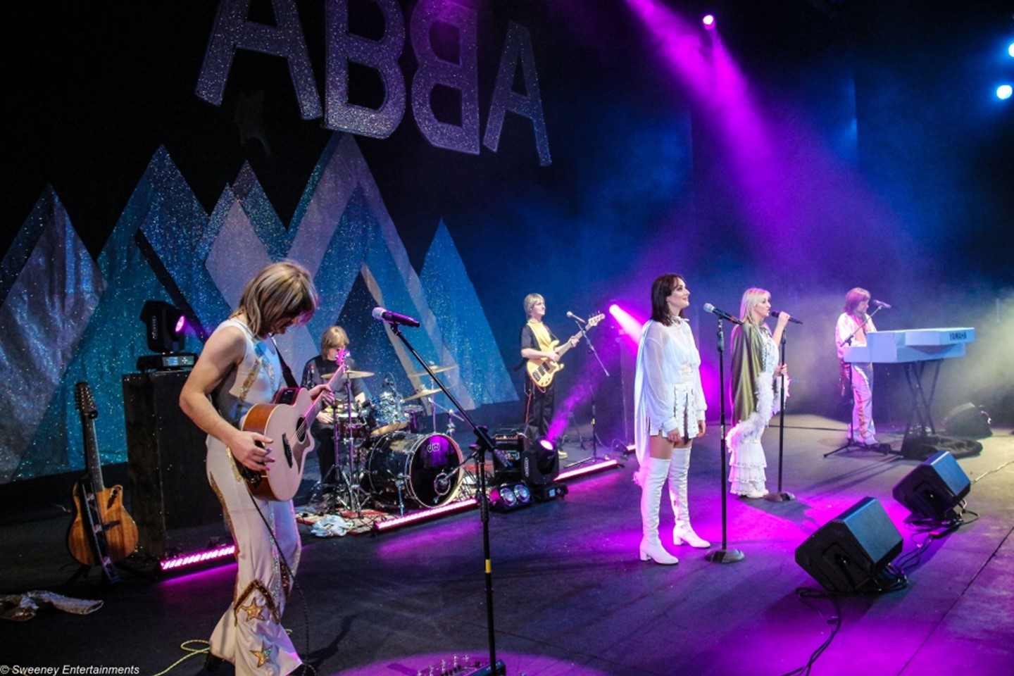 ABBA tribute concert performing on stage 