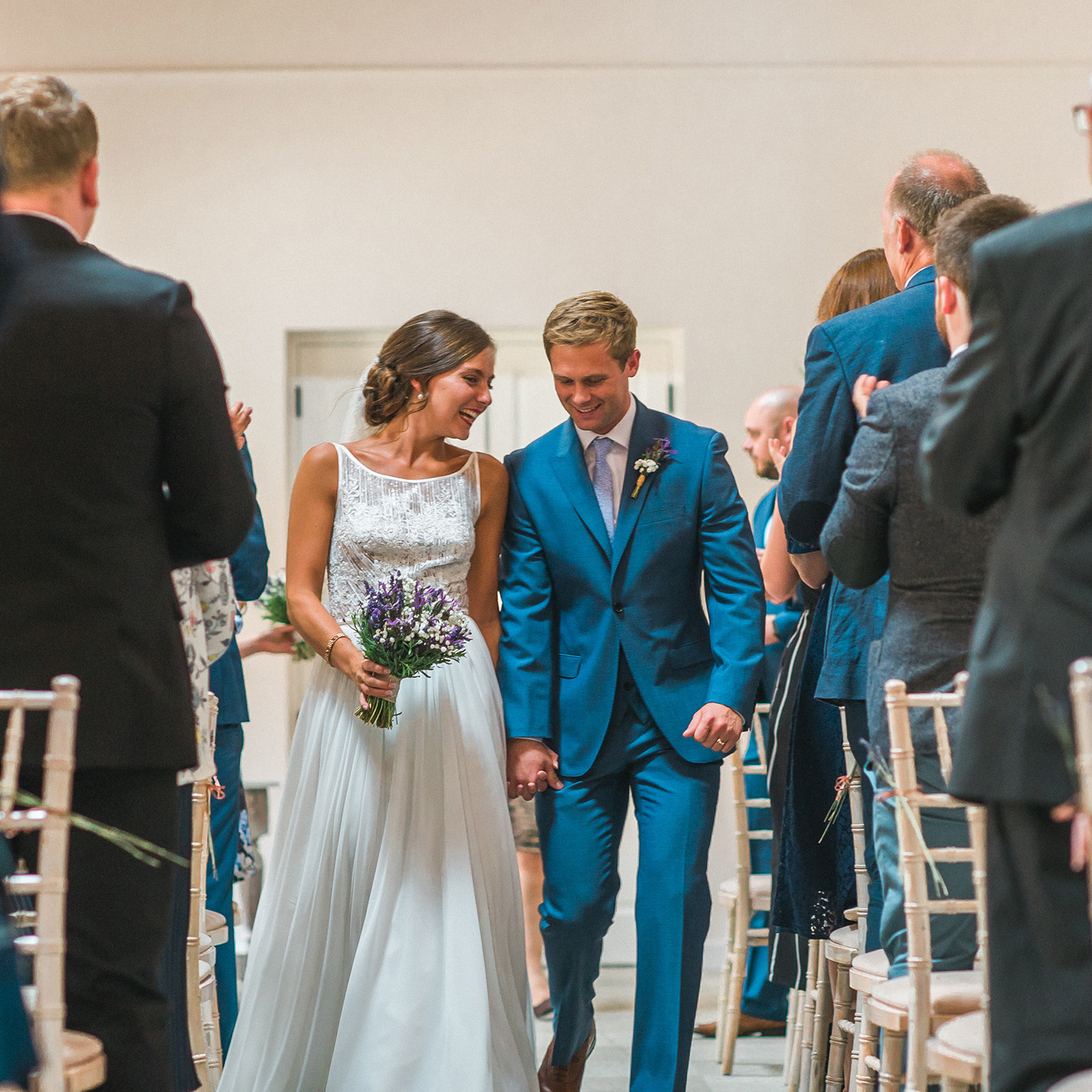 Bride and groom walking down the aisle