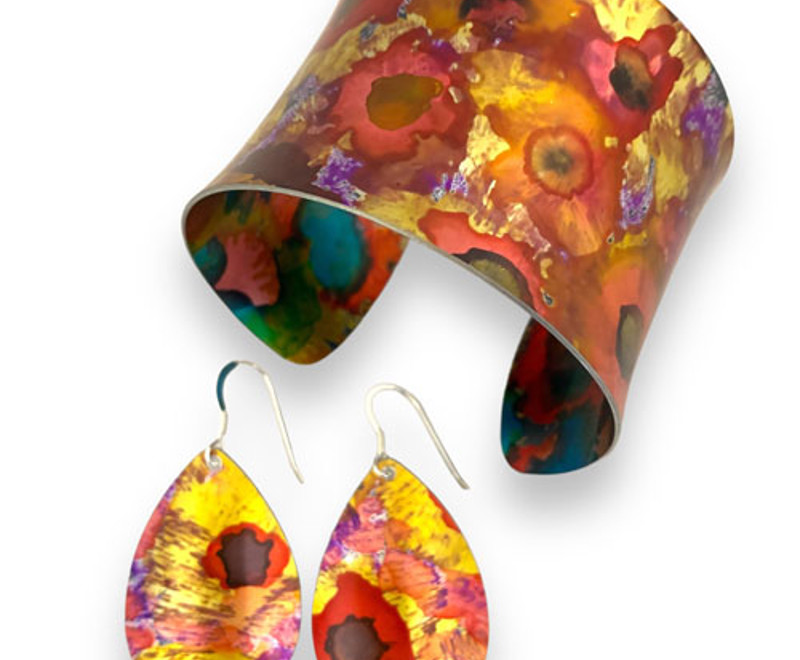 abstract SMALL floral red orange gold purple anodised aluminium cuff bracelets bangles earrings rings open ended adjustable very colourful jewellery by miranda peckitt 2025.jpg
