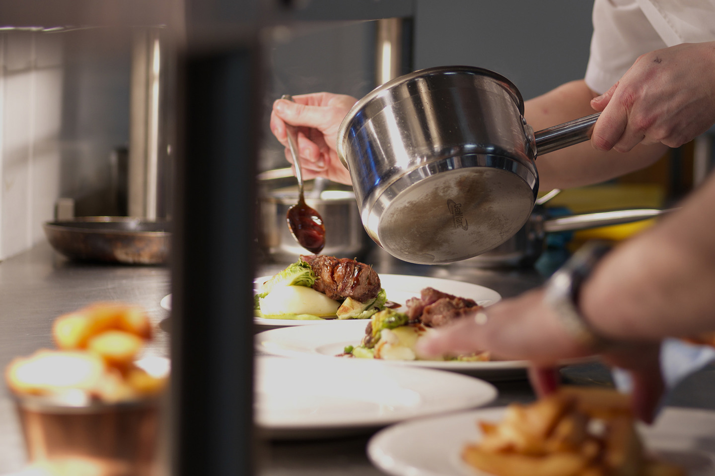 Chef plating dishes in the kitchen