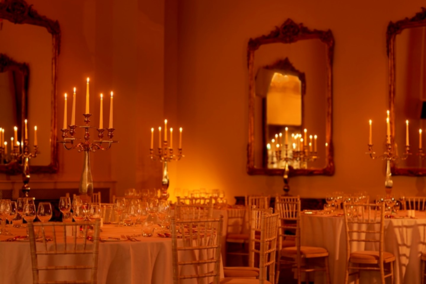 Versailles room set up for dinner with candleabras 