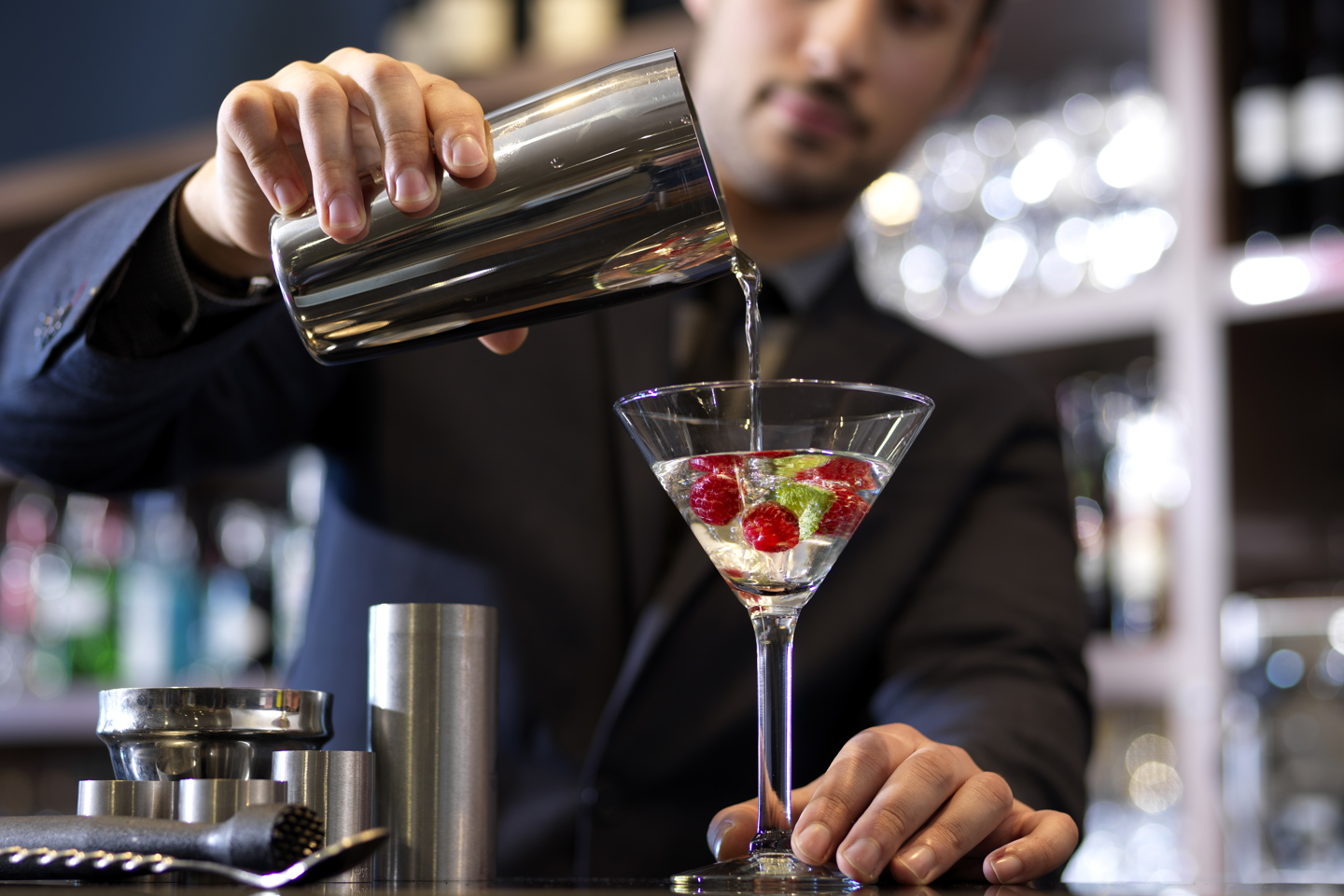 Bartender pouring a cocktain drink