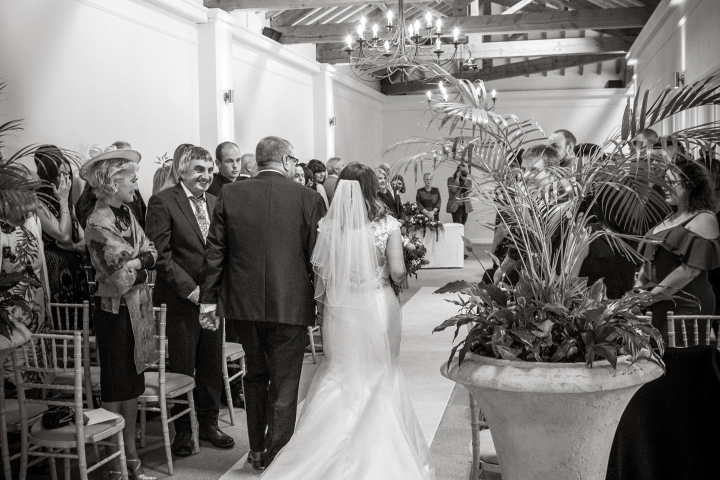 Bride walking down the aisle at Cloisters wedding reception