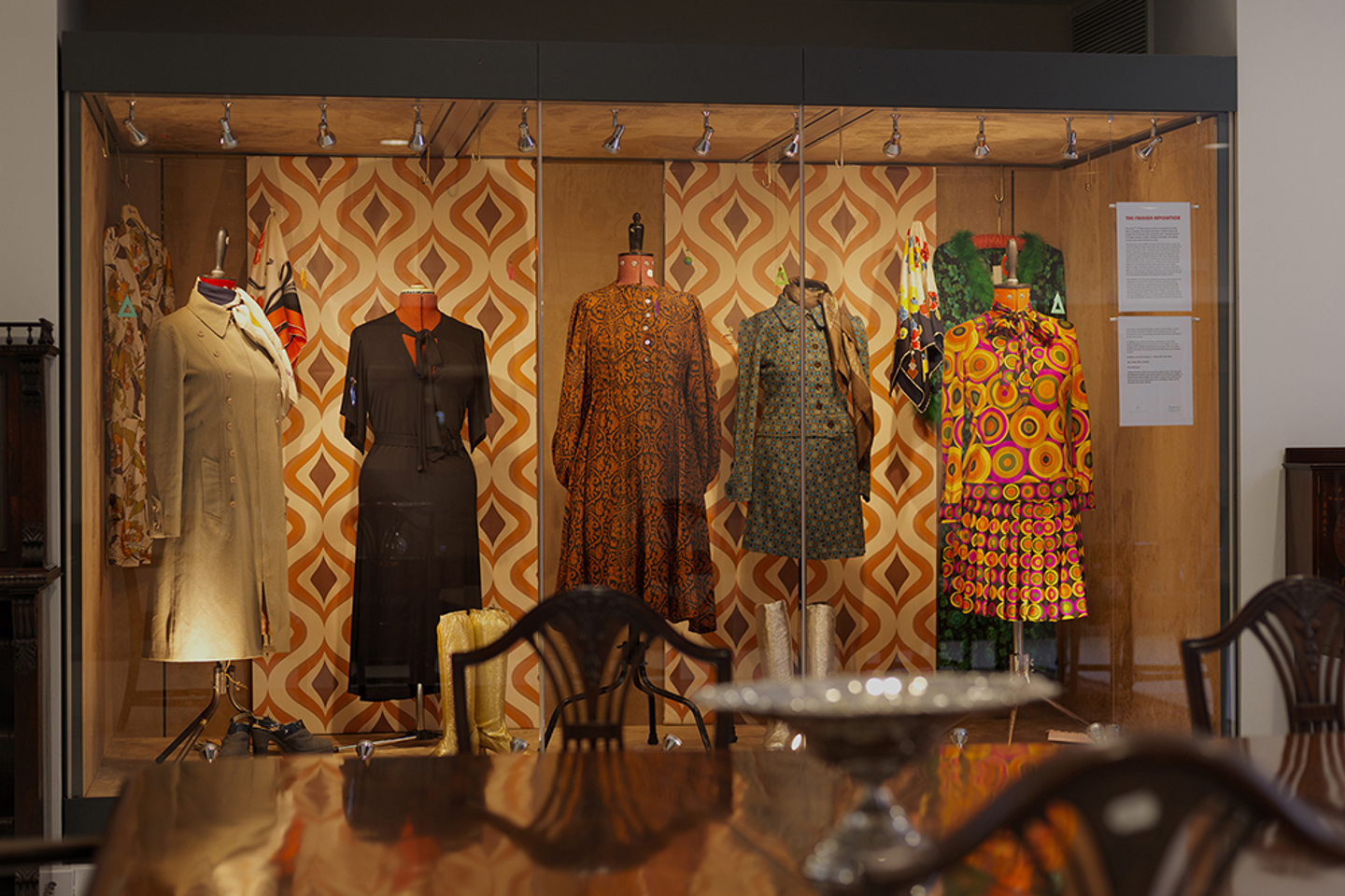 Auction lots on display in a cabinet