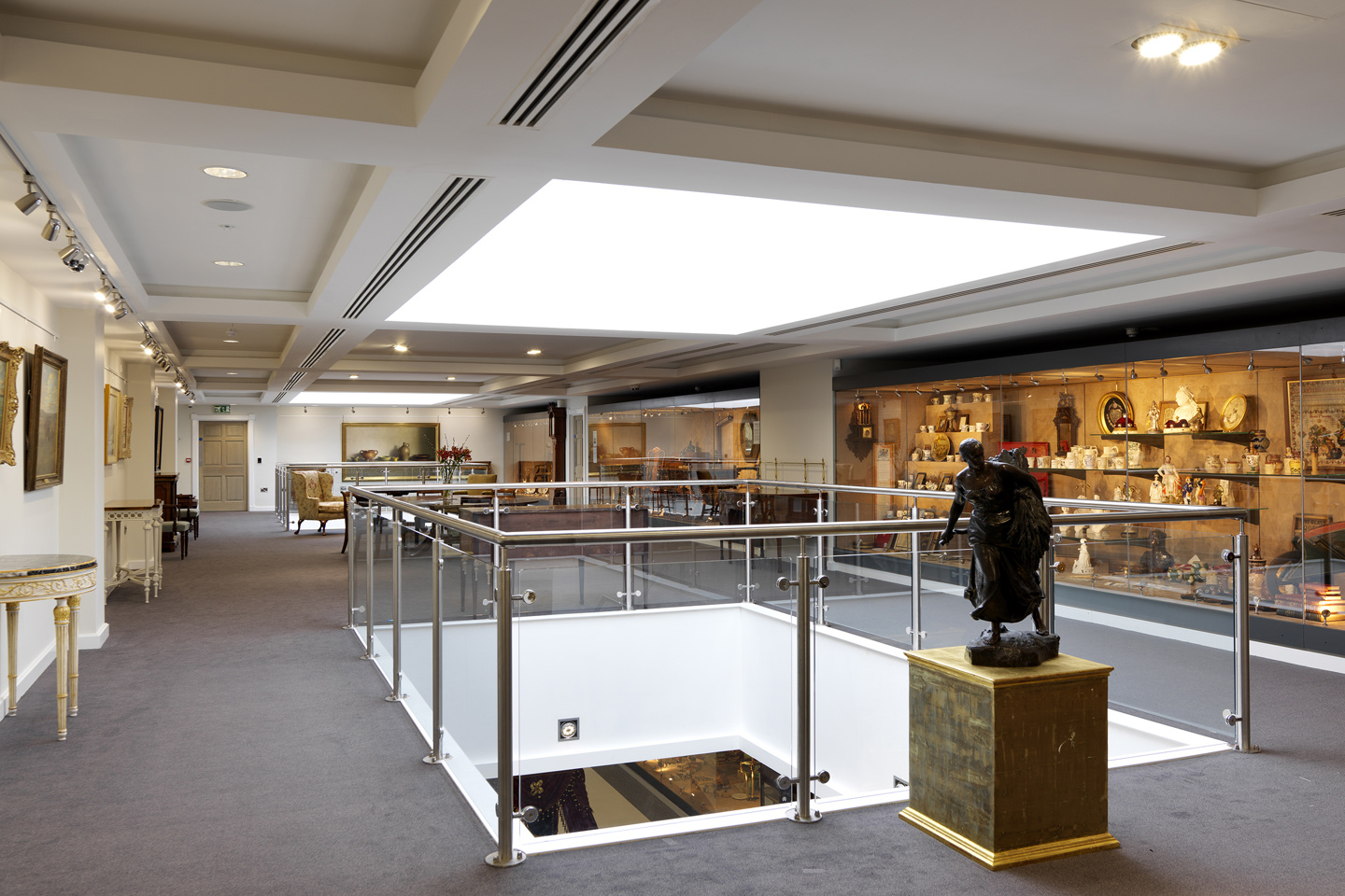 Gallery floor at The Garden Roos with cabinets