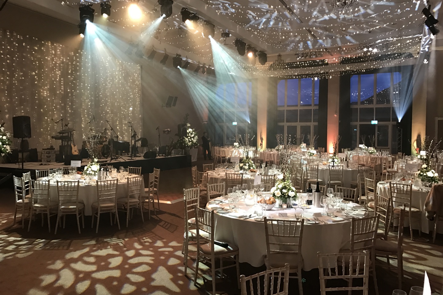 Garden Rooms set up for wedding reception, with round tables