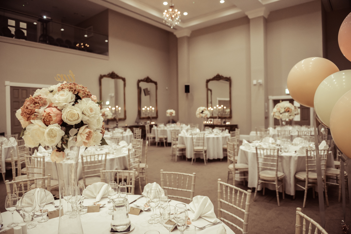 Garden Rooms set up for wedding reception, with round tables